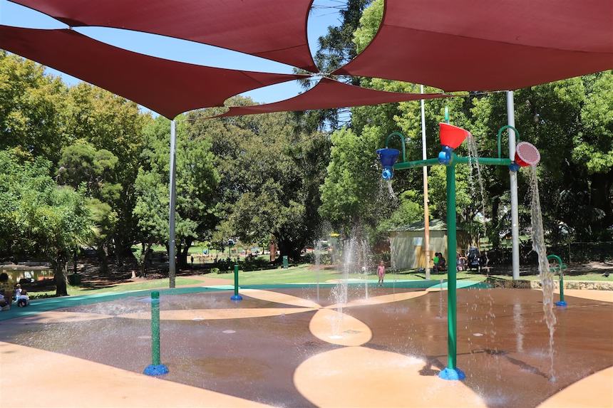 Hyde Park Water Playground combines fun water play features like tipping buckets and sprinklers, with nature play in the surrounding parklands.