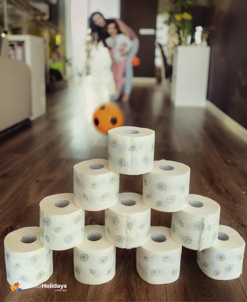 Fun games to play at home with kids: indoor bowling.