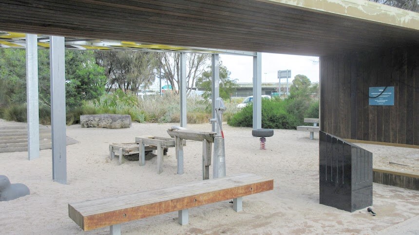 Maritime Cove Community Park Playground features climbing structures, bridges, tree stumps, water pumps & more.