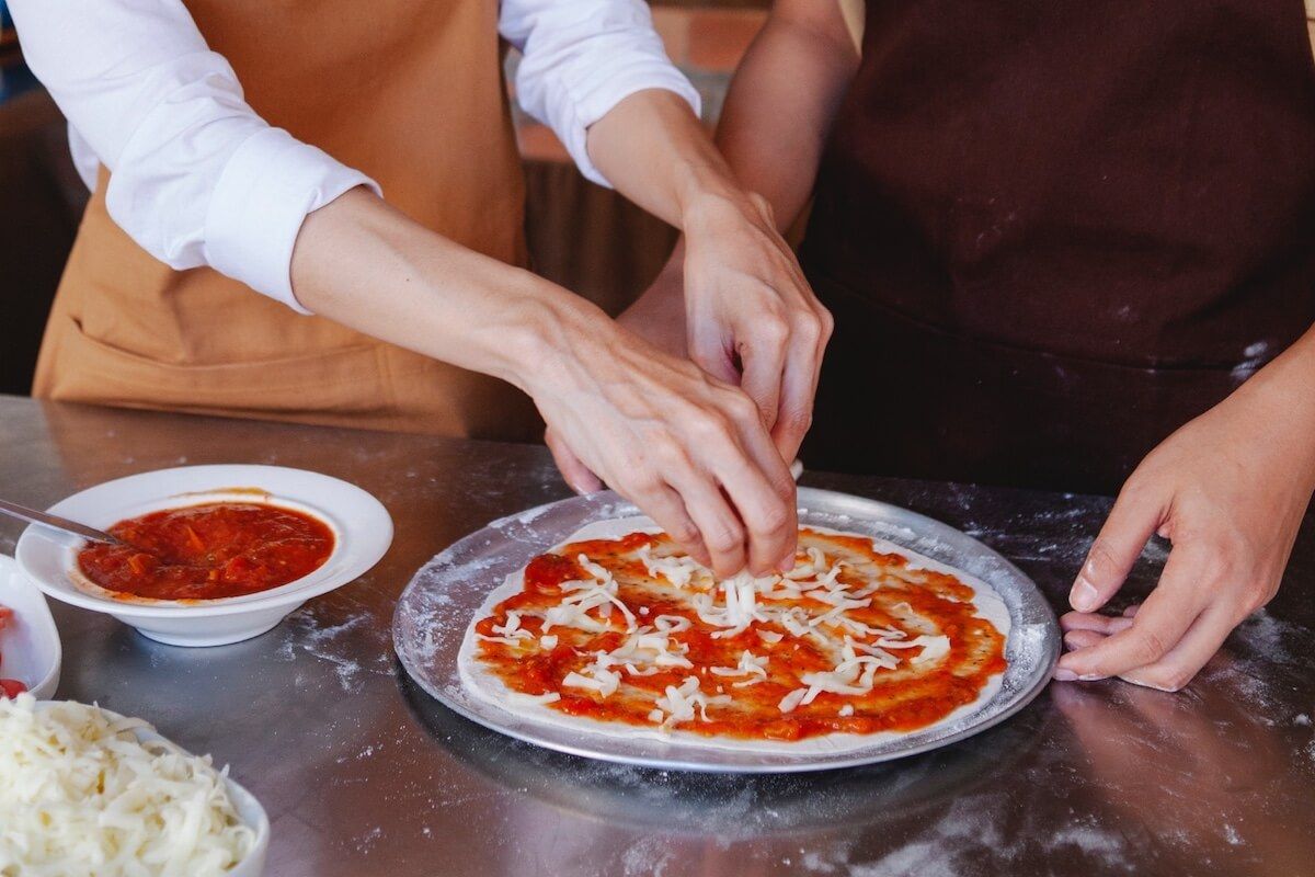 The best cheap birthday party ideas for teens: a pizza-making party.
