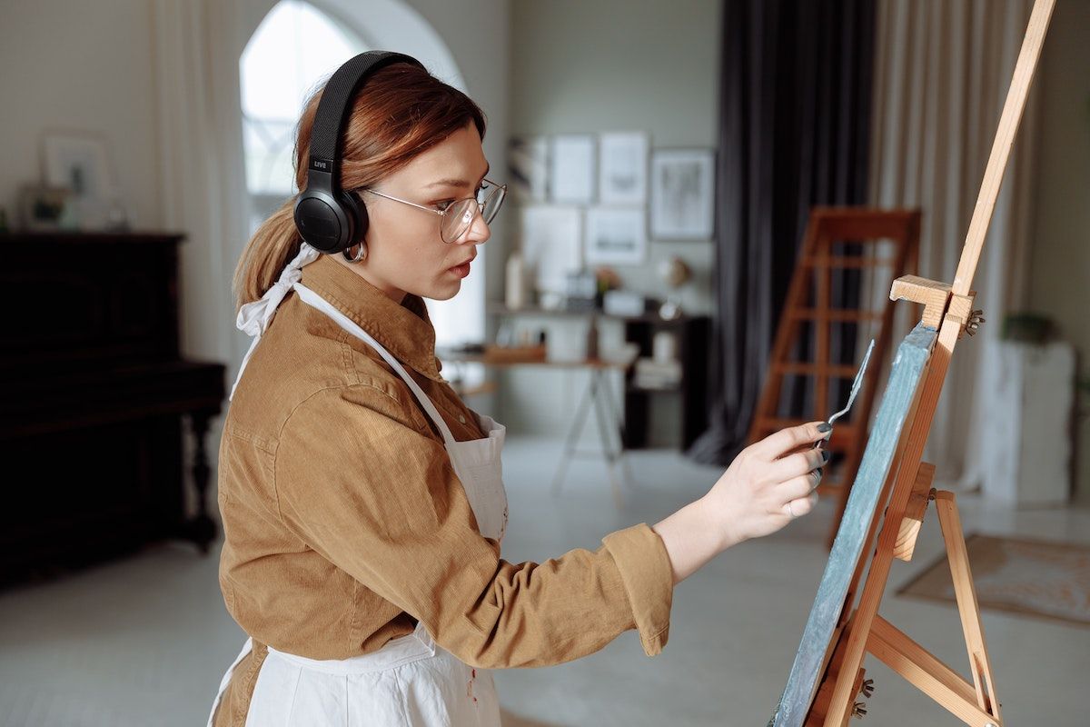 Some artists use music to set the mood while they create their artwork.