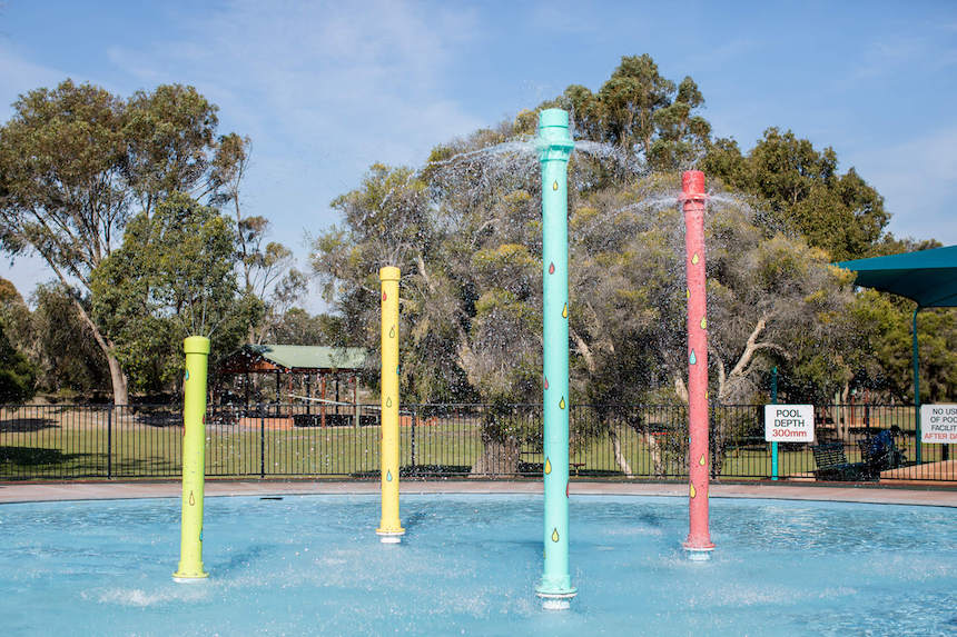 Whiteman Park Pool Playground has great water play features including a shallow splash pool with water sprinklers.